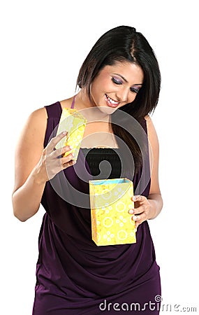 Girl with surprise seeing her gift box Stock Photo