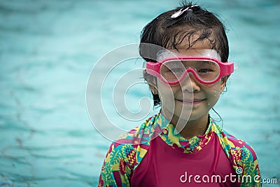 Girl swim smile goggle youth lifestyle asian enjoy swimwear Stock Photo