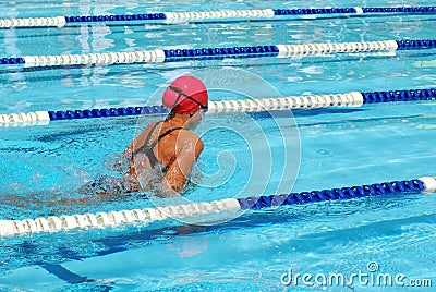 Girl swimming breaststroke Stock Photo