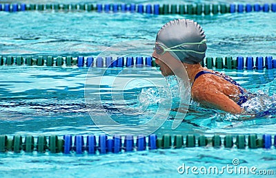 Girl swimming breaststroke Stock Photo