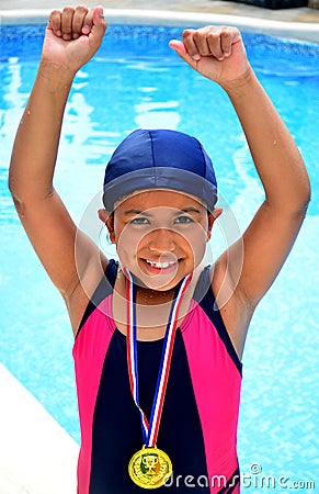 Girl in swimsuit with medals Stock Photo