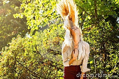 Girl swinging hair in the park Stock Photo