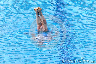 Girl Synchronised Swimming Underwater Legs out Stock Photo