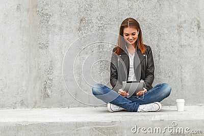 Girl with a tablet in hands Stock Photo