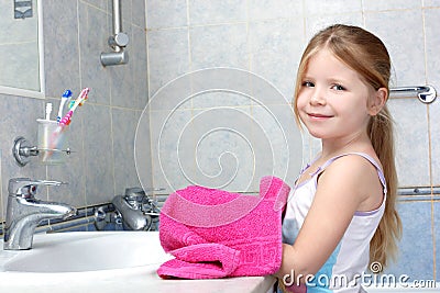 Girl taken towel in bathroom Stock Photo