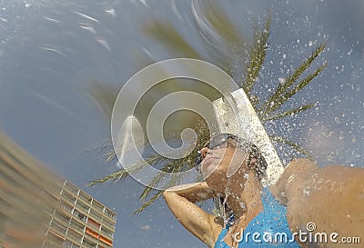 A girl takes a shower on magaluf beach in Majorca Stock Photo