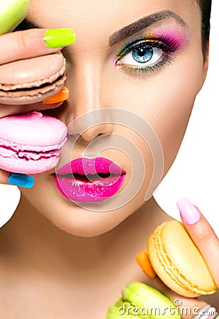 Girl taking colorful macaroons Stock Photo