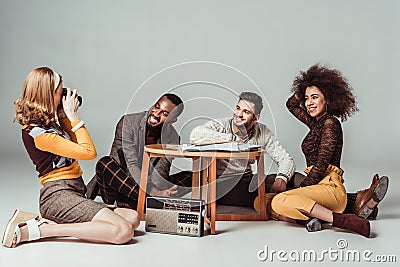 girl taking photo with film camera of multicultural retro Stock Photo