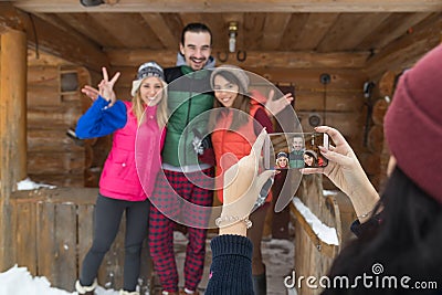 Girl Taking Photo On Smart Phone People Group Wooden Country Mountain House Winter Snow Resort Stock Photo