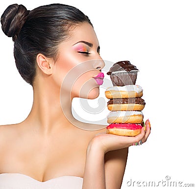 Girl taking sweets and colorful donuts Stock Photo