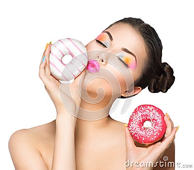 Girl taking sweets and colorful donuts Stock Photo