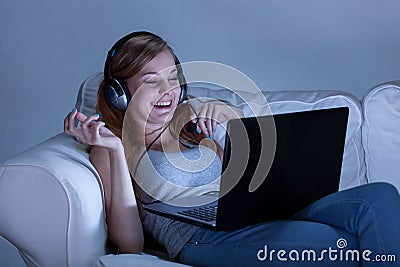 Girl talking on skype at night Stock Photo