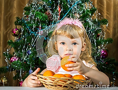 Girl with tangerines Stock Photo