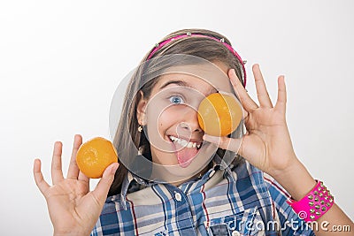 Girl and tangerines Stock Photo