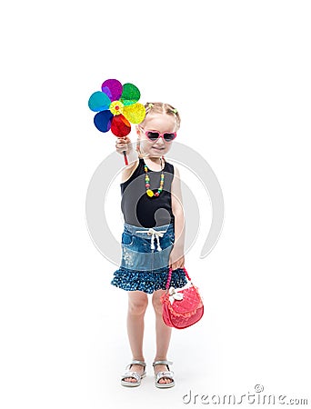 Girl in tanktop and skirt with a toy Stock Photo