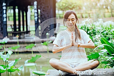 Girl teen hand palms together at chest practice yin yang force calm peaceful Stock Photo