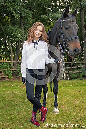 Girl teenager with a horse Stock Photo