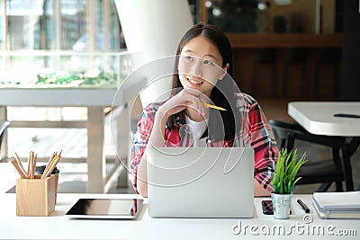 Girl teenager college high school student studying with computer Stock Photo