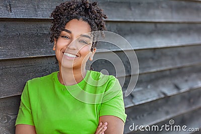 Girl teenager teen female young African American woman outside smiling with perfect teeth Stock Photo