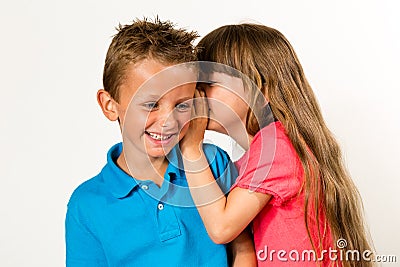 Girl telling funny story to boy Stock Photo