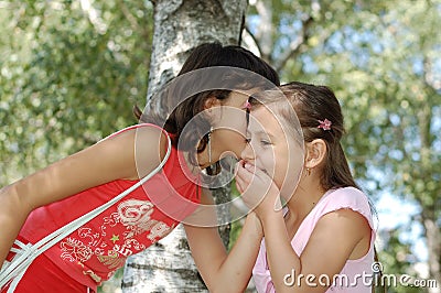 Girl Telling A Joke Stock Photo