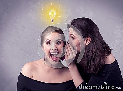 Girl telling secret things to her girlfriend Stock Photo