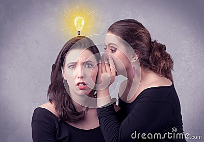 Girl telling secret things to her girlfriend Stock Photo