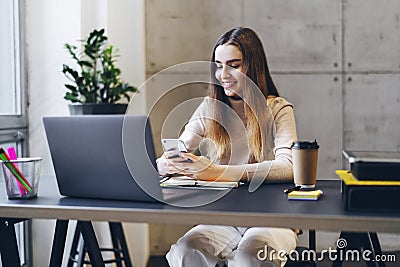 Girl texting on smartphone. Manager having break at office, playing mobile games. Young woman commenting in social network app, Stock Photo