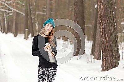 Girl with a thermos in the cold Stock Photo