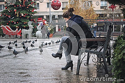 Girl thoughtfully sitting on the bench. Editorial Stock Photo
