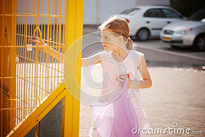 Girl throws out garbage Stock Photo