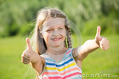 Girl thumbs up Stock Photo