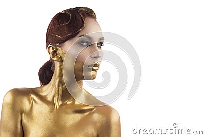 The girl tinted in gold, isolated on a white background Stock Photo