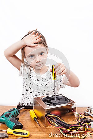 Girl tired while repairing components of a PC Stock Photo