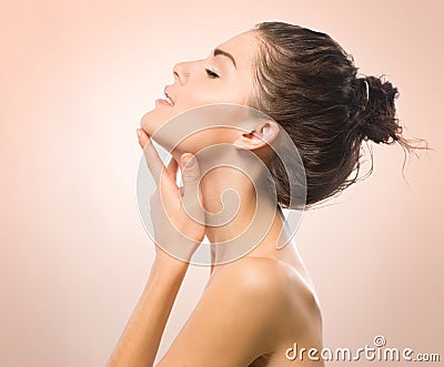 Girl Touching her Face Stock Photo