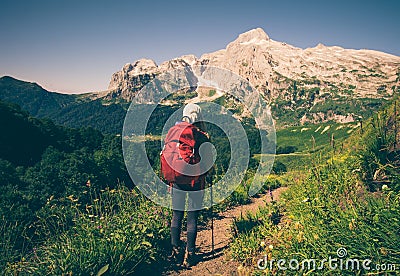 Girl Traveler hiking mountains Stock Photo