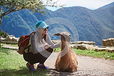 Girl traveller with lama Stock Photo