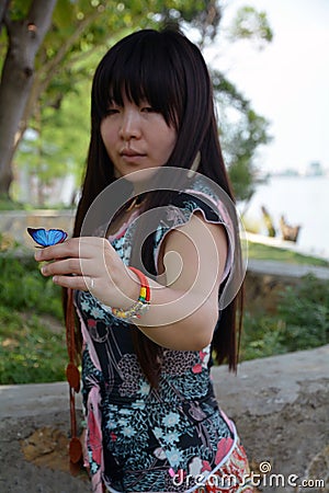 Girl tree butterfly Stock Photo