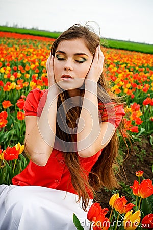 Girl in tulips field Stock Photo