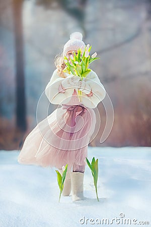 Girl with tulips in spring park Stock Photo