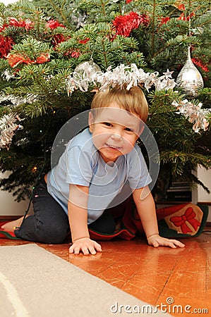 Girl Under Christmas Tree Stock Photo