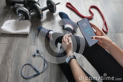 A girl uses fitness app Stock Photo