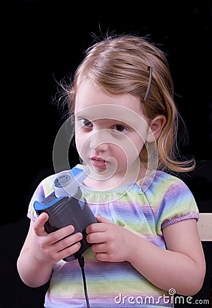 Girl using nebulizer Stock Photo