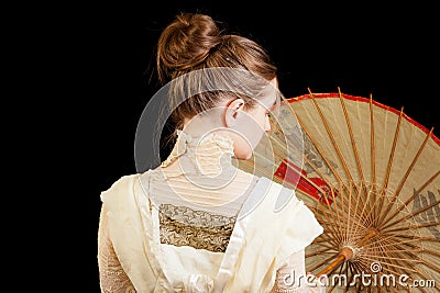 Girl Victorian dress back Chinese umbrella Stock Photo