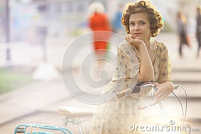 Girl with vintage bike Stock Photo