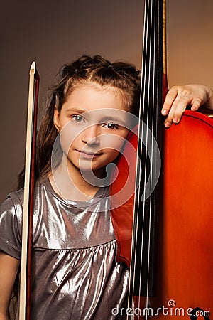 Girl with violoncello and string on gel background Stock Photo