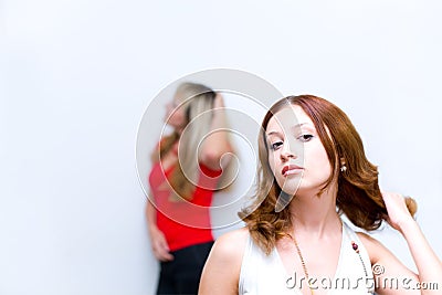 Girl waiting when girlfriend correcting hairstyle Stock Photo