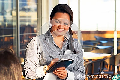 The girl waitress take a customer`s order Stock Photo