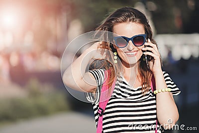 Girl Walking And Calling On Smartphone Stock Photo