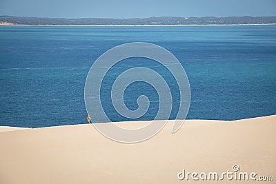 Girl walking on the white dunes on the Bazaruto Island Stock Photo